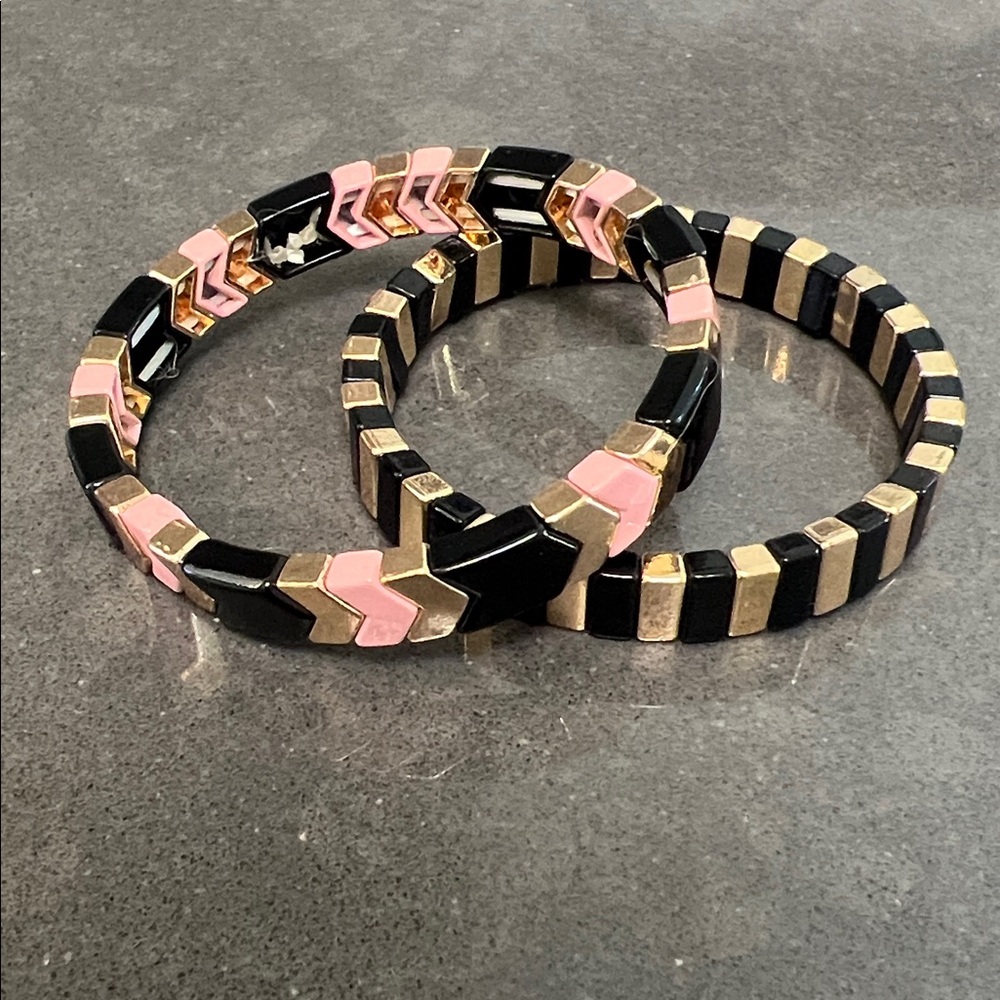 Bracelet stack black gold and pink